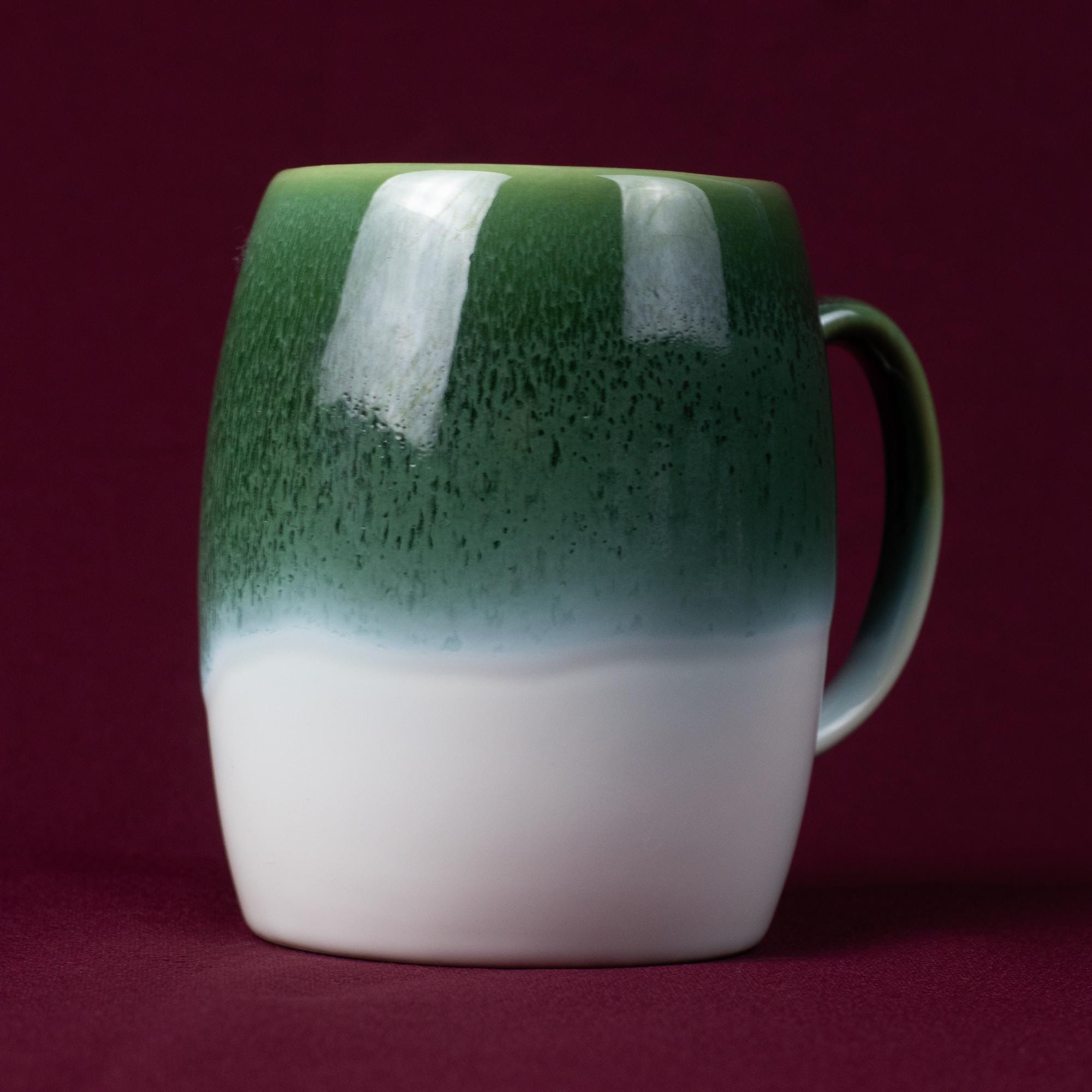 Dark Green & White Drip Glaze Stoneware Mug showcasing organic glaze pattern and contoured handle.