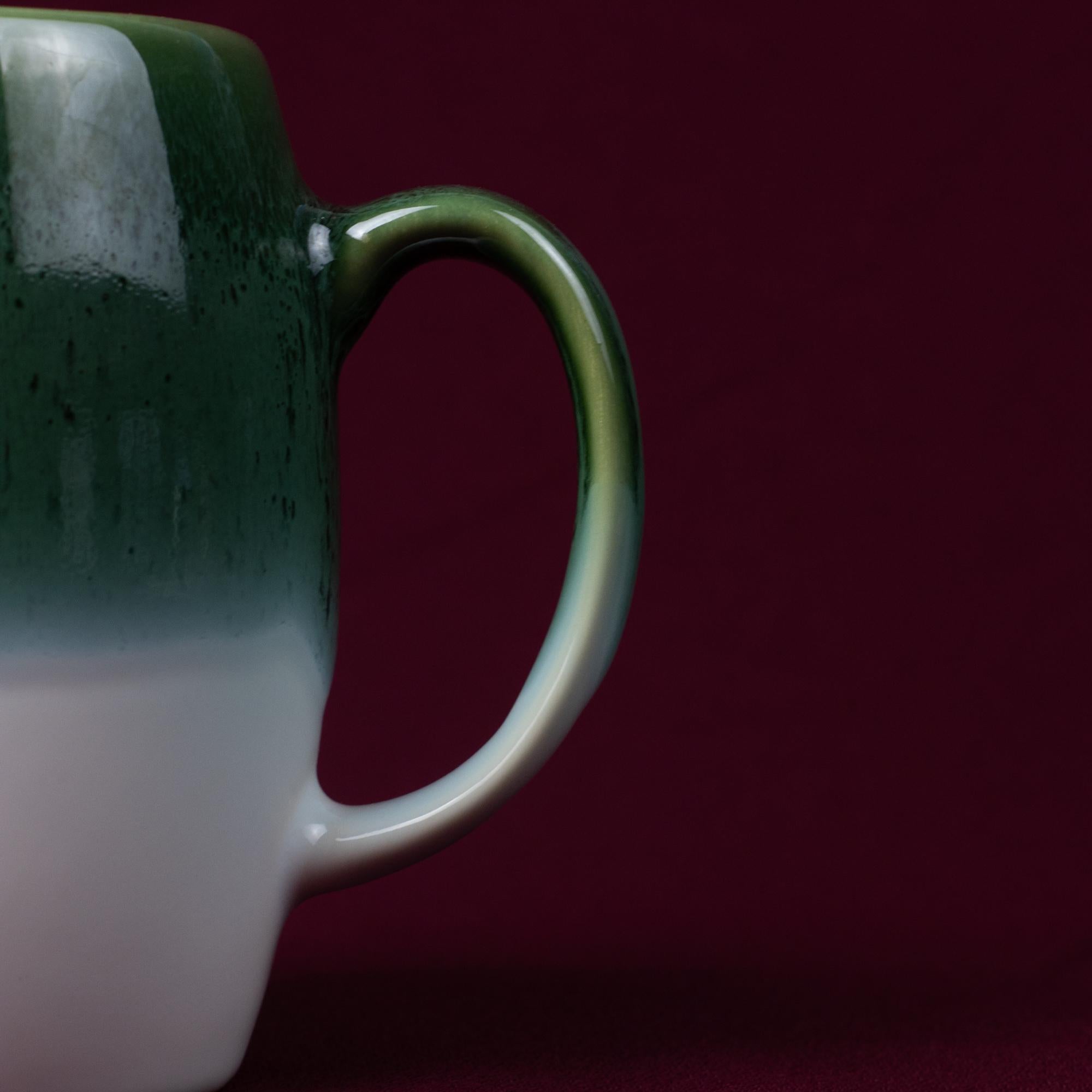Dark Green & White Drip Glaze Stoneware Mug with a contoured handle and organic glaze pattern.